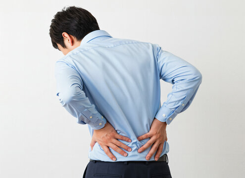 Man feeling pain in his lower back: Generated image
