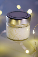 Scented candle with wooden wick in a glass jar. Hand-made candles made of natural coconut wax with aroma fragrance.