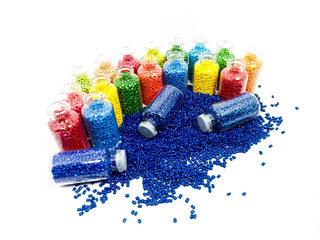 various colors of mastebatch granules in glass container, colorful pigment virgin resin, isolated...