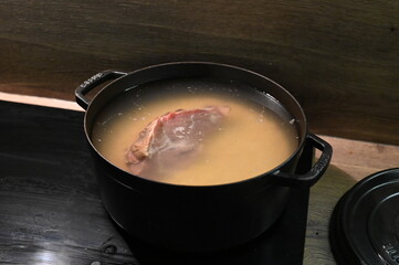 Traditional pea soup with smoked meat. A hearty and flavorful Czech dish, this pea soup is made with dried peas and rich smoked meat, offering a satisfying and comforting meal.