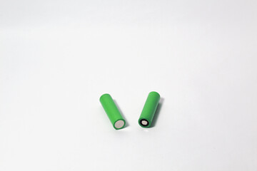 Rechargeable green 18650 Li Ion battery on isolated white background. Often used for electric cigarette, toys, or remote control.
