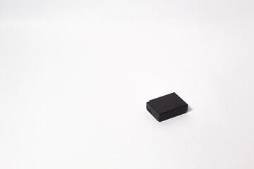 Black Li Ion camera battery on isolated white background