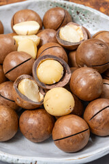 Australian Queensland macadamia nuts, or bush, maroochi, bauple nut, with sawn nutshell, fresh harvest