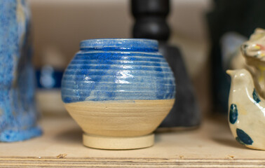 Samples of ceramic art objects and tabelware during workshop in art ceramic atelier in Poland