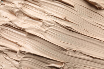 Fototapeta premium Liquid foundation texture. Make up base, BB cream smear background