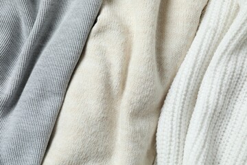 Knitted clothes background, close up view