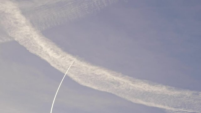 A contrail in the sky. A condensation trail that is formed during the flight of an aircraft in the upper layer of the troposphere