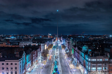 Aerial view of O'Connell Street at night, featuring the iconic Spire at the center