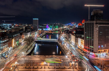 Aerial view of Dublin, captured in long exposure, showcasing the vibrant city life and colorful lights