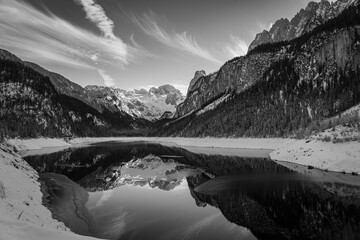 Mountain scenery in the Alps with Dachstein summit reflecting in Lake Gosausee, Salzkammergut, Austria in the Winter 