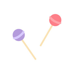 Colorful lollipops resting on a white surface during daytime