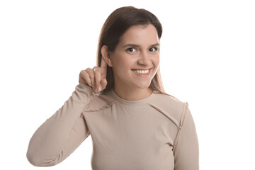 Woman showing hand to ear gesture on white background