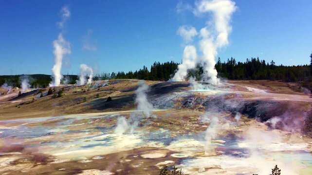 Steam rising from thermal vents  in the.Norris Geyser Basin, Yellowstone National Park, Wyoming, USA	