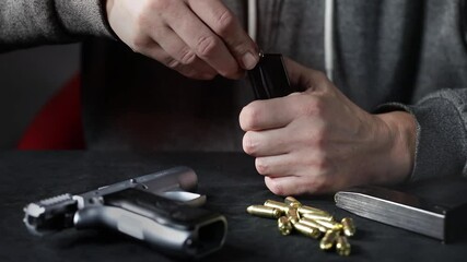 Loading of older semi automatic inox compact pistol magazine caliber 9x19 of israel production