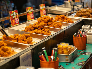 December 24, 2024, Chiang Rai: Golden crispy fried chicken ready to eat at the night market. Street food in the market of Thailand.