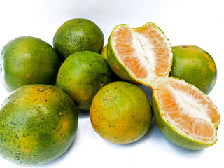 Collection of fresh Citrus fruits (Oranges) and one opened or peeled fruit. Fruits isolated on a white background
