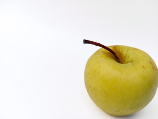 Sweet yellow apple on a white background