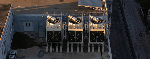 Cooling towers in data center building. Air conditioning cooling towers in front of building with...