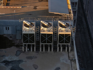 Cooling towers in data center building. Air conditioning cooling towers in front of building with...