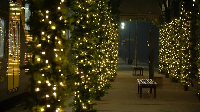 A decorated train platform in a Christmas spirit
