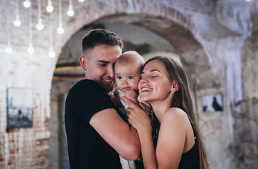family photo of baby with parents