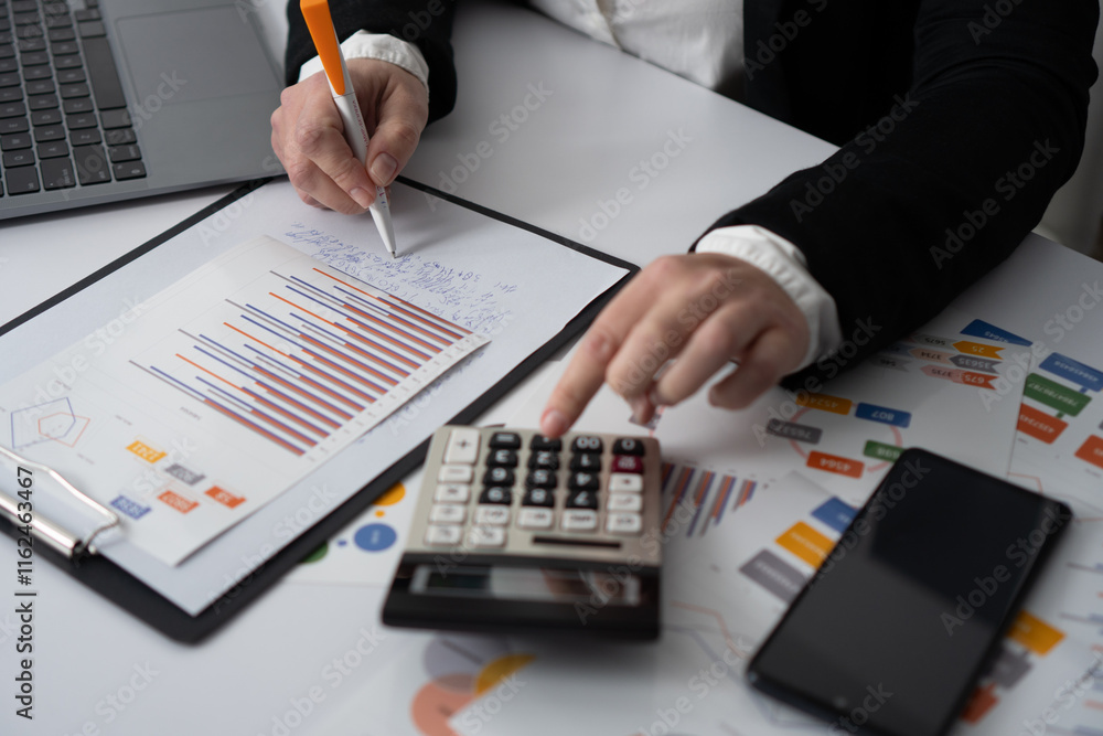 Poster a dedicated business professional is thoroughly analyzing complex financial data using a calculator 