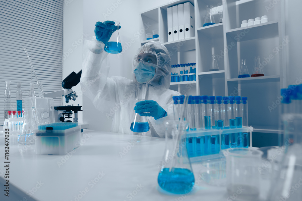 Aufkleber A dedicated scientist is actively conducting a detailed experiment in a stateoftheart modern laboratory, utilizing advanced techniques and an array of tools to explore new scientific ideas