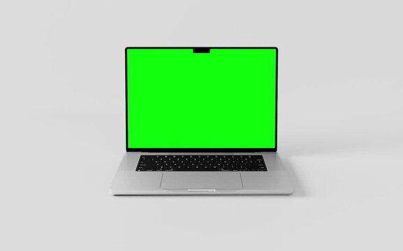  Laptop with blank green screen isolated on white background. Macbook blank green screen mockup. 60fps 4k UHD video	