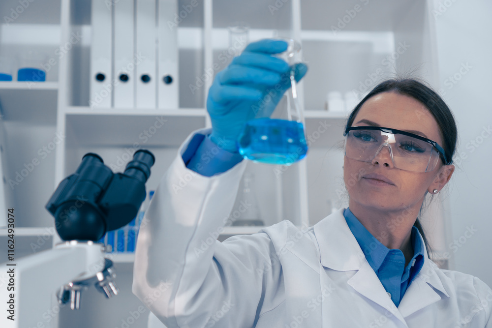 Poster a dedicated female scientist meticulously analyzing a chemical solution within a wellequipped labora