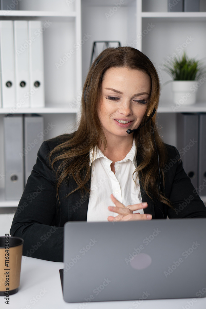Poster A dedicated business professional is engaged in a virtual meeting while efficiently working from the comfort of their own home, showcasing the importance of remote collaboration and engagement