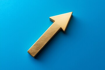 Solid Gold Upward Arrow on Blue Background Representing Growth and Success