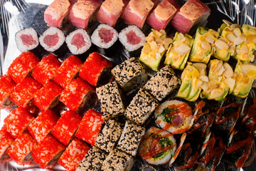 isolated sushi on black background. assorted sushi