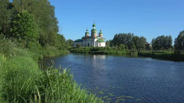 Cathedral of the Smolensk icon of the mother of God on the river Megrega in the summer landscape. Olonets, Karelia