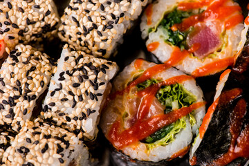 isolated sushi on black background. assorted sushi
