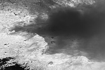 boiling water in the hot springs in black and white film negative