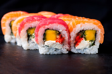 isolated sushi on black background. assorted sushi