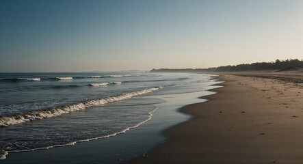 Morning light on a deserted beach with small waves whispering along the shore