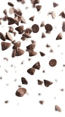 Fototapeta premium Chocolate chips falling against a white background