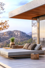 Modern outdoor lounge area with mountain view at sunset