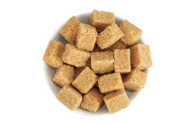 brown sugar in a ceramic bowl isolated on white background. Top view. Flat lay