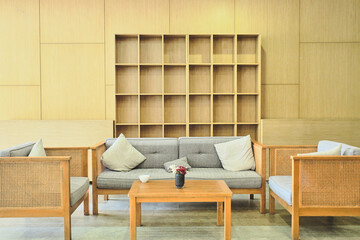 a space of built-in wooden shelf at the wall of the building on the corridor