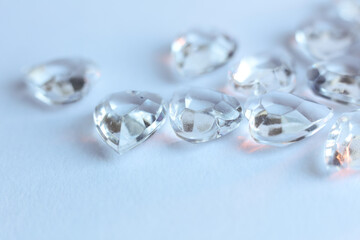 Diamonds on a white background. Macro photo with shallow depth of field.