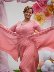 young woman in pink dress