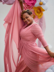 pregnant woman in pink dress