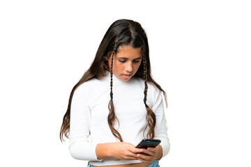 Young girl over isolated chroma key background sending a message with the mobile