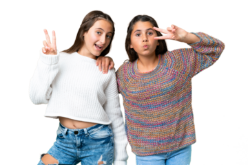 Friends girls over isolated chroma key background smiling and showing victory sign