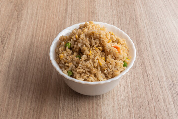 Typical Chinese recipe for three-delicacy rice in a white bowl