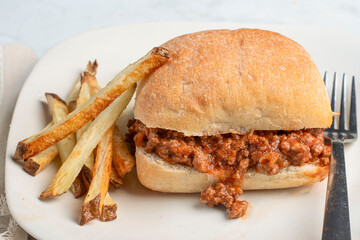 sloppy   joe on a  ciabatta  roll with fries