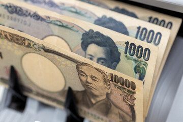 Japan money. Money counting machine with Japanese yen. Business concept. Financial operations,...