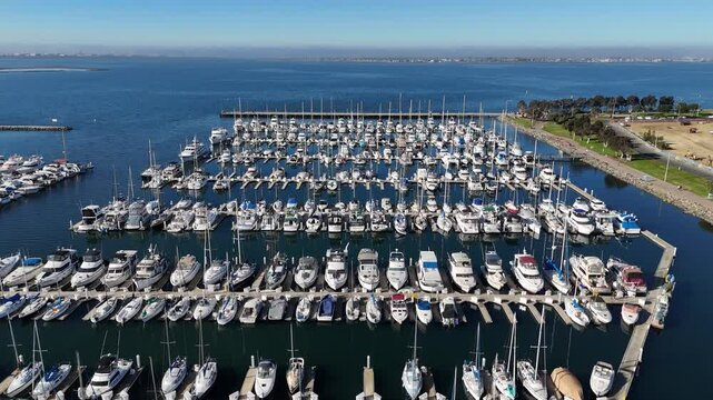 Aerial drone view of sailboats docked in Chula Vista in San Diego, CA on a sunny day